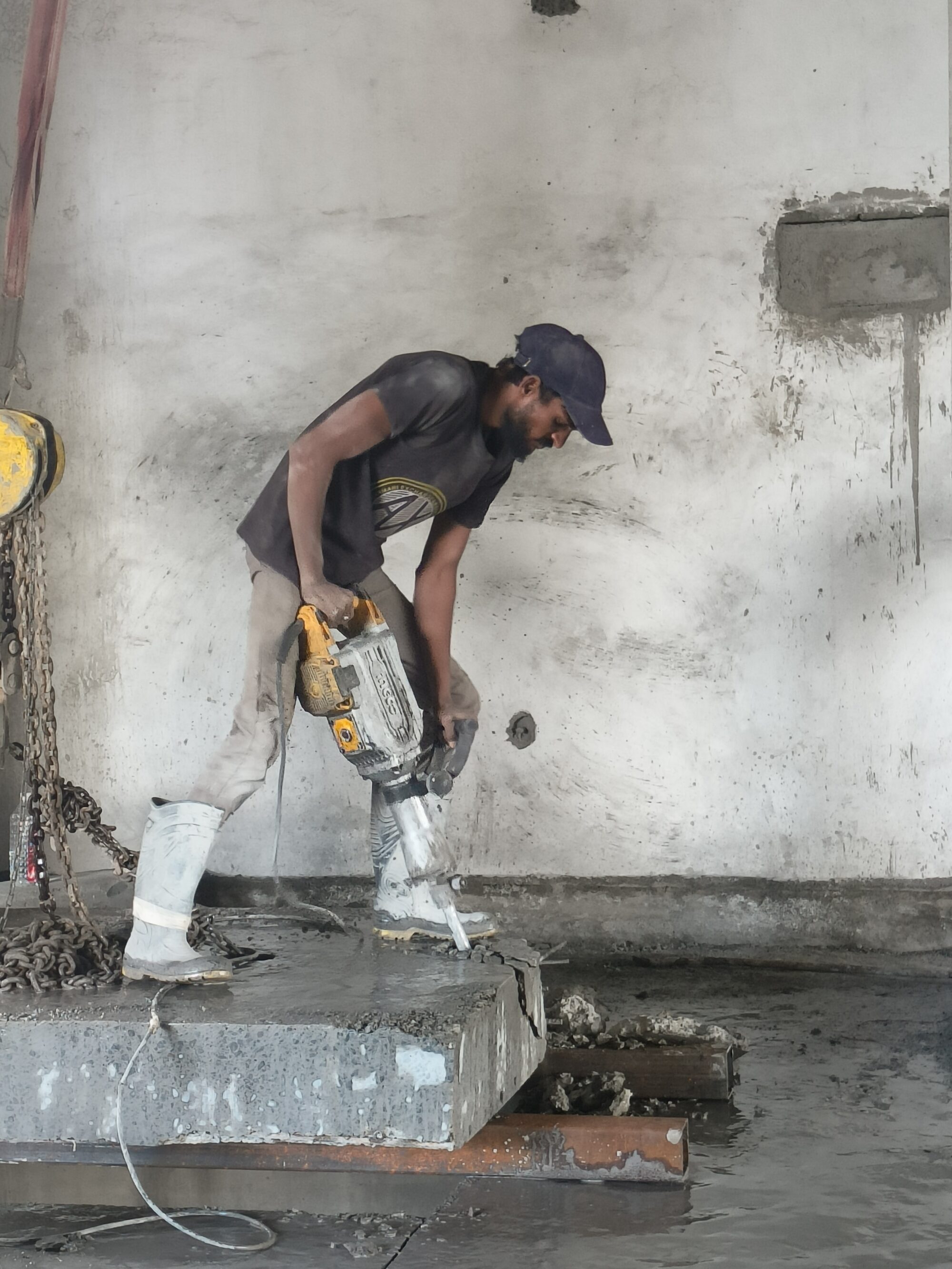Controlled demolition using handheld equipment Reinforced concrete demolition project Diamond cutting service by Aniruddha Enterprises Hydraulic crusher concrete demolition